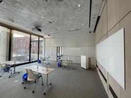 whiteboard and desks with chairs in Classroom 103